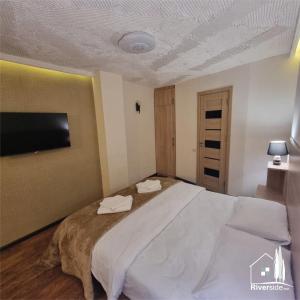 Voodi või voodid majutusasutuse River House Boutique Hotel toas