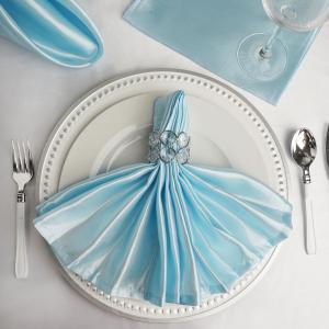 a blue dress on a plate on a table at 1st Class Covent Garden Residences for 1st Class Guests in London