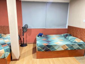 Postel nebo postele na pokoji v ubytování Sundale Hotel