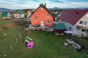 an aerial view of a house with a playground at Apartments Millenium in Žabljak