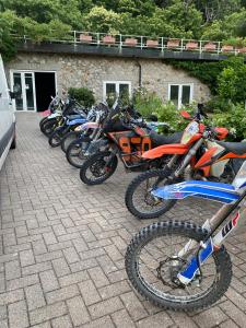 a row of motorcycles parked next to a building at Hotel Parco Erosa in Abbadia San Salvatore