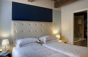 Postel nebo postele na pokoji v ubytování Hotel 500 Firenze