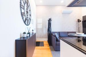 a living room with a couch and a table at ON Apartments - Lapa Deluxe in Porto