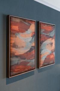 two pieces of art hanging on a wall at The Bear in Bath
