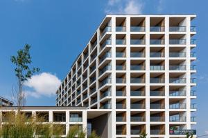 an office building with balconies on the side of it at Warsaw Praga Kokoryczki Apartments with Parking by Renters in Warsaw