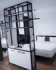 Postel nebo postele na pokoji v ubytování Kazbegi Apartments