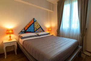 Postel nebo postele na pokoji v ubytování Bocelli Guest House