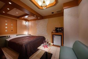Postel nebo postele na pokoji v ubytování Hotel Metro (Adult Only)
