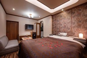 Postel nebo postele na pokoji v ubytování Hotel Metro (Adult Only)