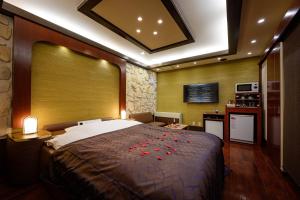 Postel nebo postele na pokoji v ubytování Hotel Metro (Adult Only)