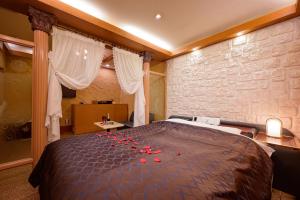 Postel nebo postele na pokoji v ubytování Hotel Metro (Adult Only)