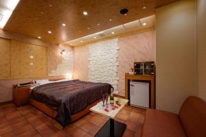 Postel nebo postele na pokoji v ubytování Hotel Metro (Adult Only)