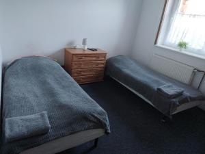 Postel nebo postele na pokoji v ubytování Gościniec Silver