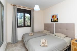Posteľ alebo postele v izbe v ubytovaní Duplex apartment Estepona + 21 fotografií
