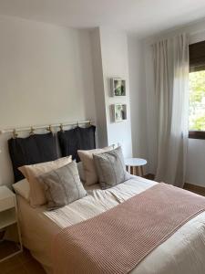 Ένα ή περισσότερα κρεβάτια σε δωμάτιο στο Apartamento al mar +15 φωτογραφίες