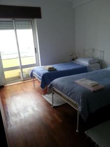 Postel nebo postele na pokoji v ubytování Rooftop Apartment