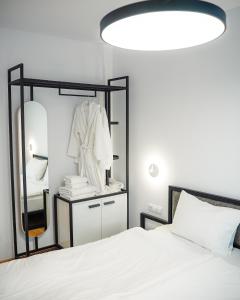 Postel nebo postele na pokoji v ubytování Kazbegi Apartments