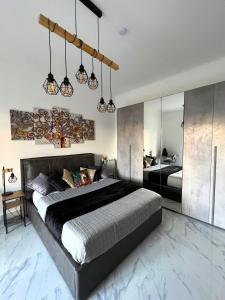 Katil atau katil-katil dalam bilik di BACARDI Lungomare - Modern apartment near the sea
