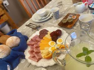 a table with a plate of breakfast food on it at Stunning BnB in Gorgeous Garden Setting in Germiston