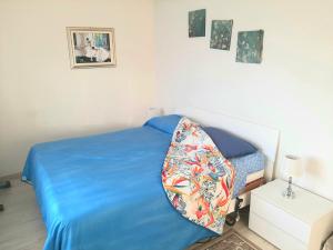A bed or beds in a room at Le case di Lulù