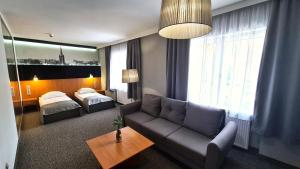 Postel nebo postele na pokoji v ubytování Hotel Malinowski Economy + 37 fotografií