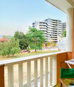 a balcony with a view of a park and buildings at Adriatic Sea Apartments in Budva