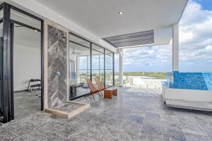 Balkón nebo terasa v ubytování Mya Residence 206 at Aldea Zama