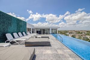 Bazén v ubytování Mya Residence 206 at Aldea Zama nebo v jeho okolí