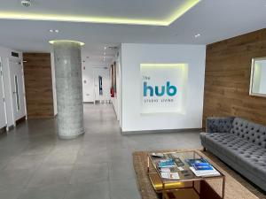 a lobby with a couch and a table at Brand New Top Floor Studio - The Hub Gibraltar - Self Catering in Gibraltar