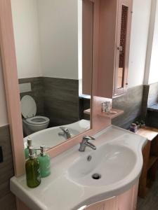 a bathroom with a sink and a toilet and a mirror at TIME TO ESCAPE 2 in Tirano +11 photos