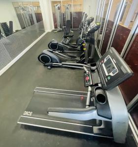 a row of exercise bikes parked in a gym at Driftwood Dreams at the Beach in Daytona Beach