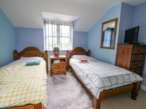Postel nebo postele na pokoji v ubytování Penybont Apartment