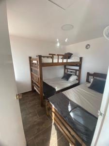 a room with two bunk beds in a room at VILLAS DEL PALMAR APTO 406 in Santa Marta