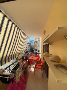 a room with a balcony with a table and chairs at Zeko Apartment in Golem