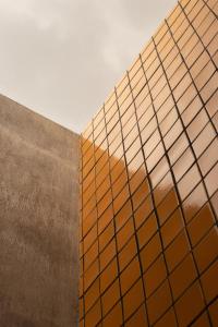 a building with a reflection of a sunset at Casa Hoyos - Hotel Boutique in San Miguel de Allende