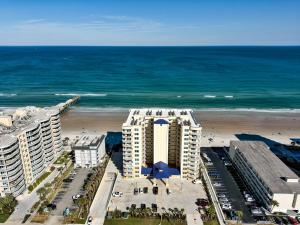 an aerial view of a building and the beach at 3 Bed 2 Ba Wifi Kitchen Walk to Beach FirePit in Daytona Beach