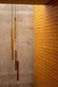 a group of lights hanging from a wall at Casa Hoyos - Hotel Boutique in San Miguel de Allende +66 photos