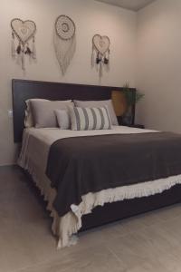 a bedroom with a large bed with hearts on the wall at 2 Bed Bath for 5 Casa Azul in Tulum