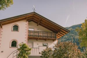 a building with a balcony on the side of it at 164 apt. in Val di Vizze