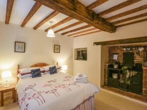 a bedroom with a large bed in a room at Garth Ucha in Llanyblodwel