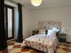Postel nebo postele na pokoji v ubytování La Casa de Baeza