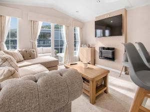 a living room with a couch and a table at European Lodge - Uk40848 in Scarborough