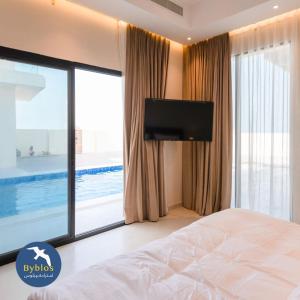 TV a/nebo společenská místnost v ubytování Byblos Villa Resort + 15 fotografií