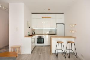 Kuchyňa alebo kuchynka v ubytovaní Ingenious Wilanów Oasis Apartment