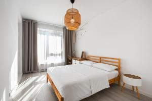 Posteľ alebo postele v izbe v ubytovaní Ingenious Wilanów Oasis Apartment