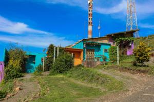 an old building with a tower on a hill at Vila Ecológica Cambará in Cambará