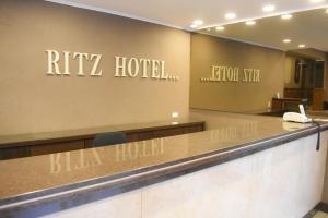 a reception desk in a hotel with the words raik hotel at Ritz Hotel Mendoza in Mendoza