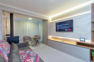 TV a/nebo společenská místnost v ubytování Com vista para Catedral - @stayhousetemporada