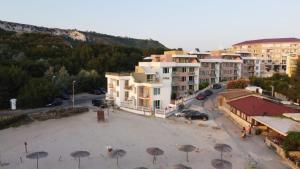 an aerial view of a city with umbrellas at Two-Bedroom Apartment with Sea View in Kavarna