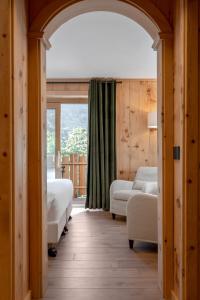 Postel nebo postele na pokoji v ubytování Hotel Baita Dei Pini